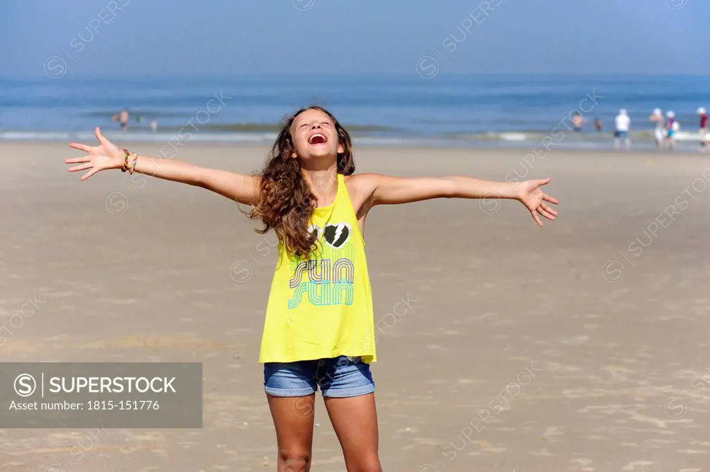 Holland, Zeeland, Domburg, girl enjoying beach and sun