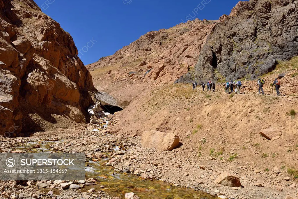 Iran, group of people hiking in Khoram Dasht valley, Alam Kuh area, Alborz mountains