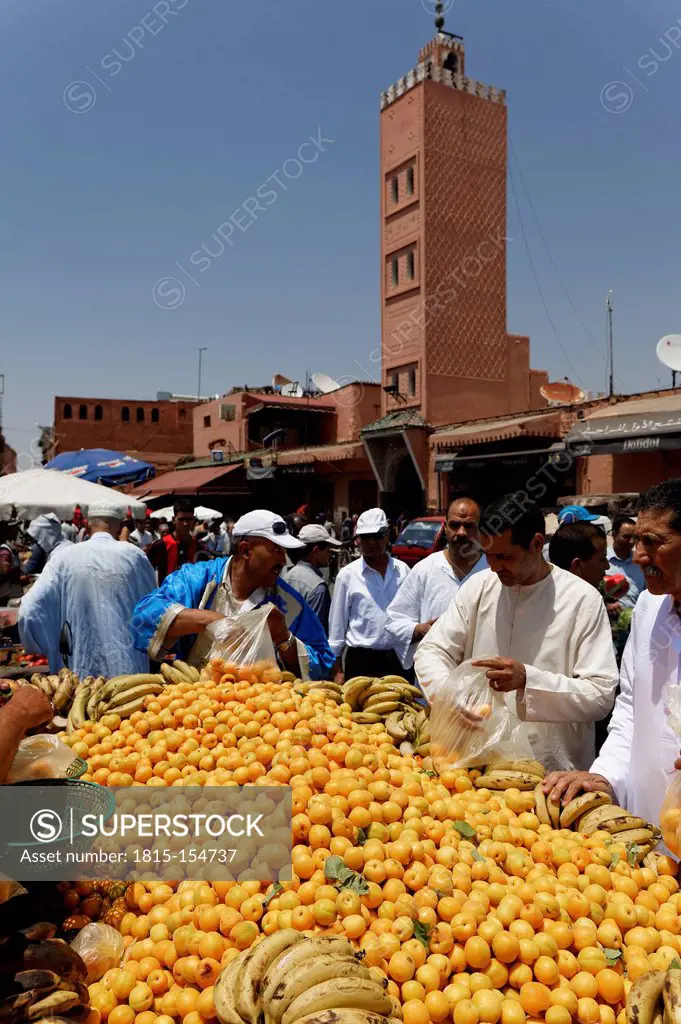 Africa. Morocco, Marrakesh, People at Djemaa el Fna square with Koutoubia Mosque