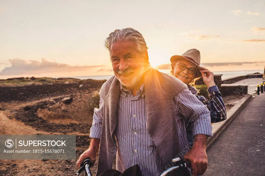 Happy active senior couple on bicycle, Tenerife