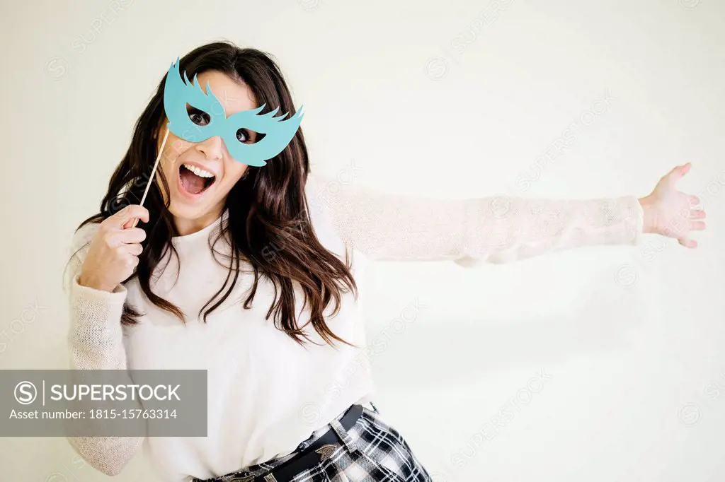 Portrait of playful young woman with comedy glasses