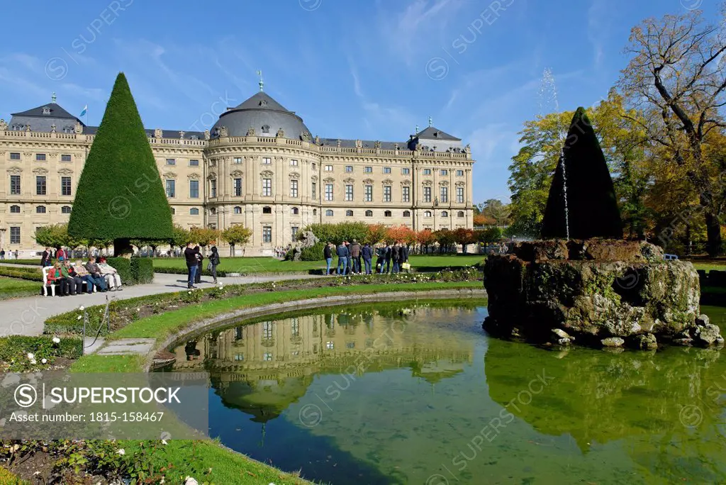 Germany, Bavaria, Wuerzburg, View of fountain with wuerzburg residence in the background