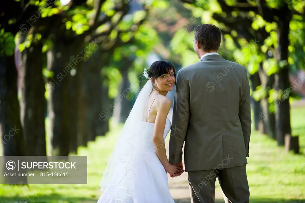 Happy bride and groom outdoors