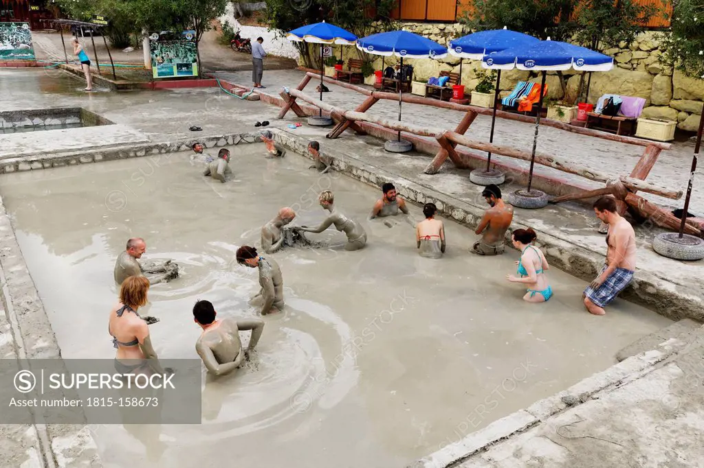 Turkey, Province Mugla, People taking a mud bath at Sultaniye thermal bath