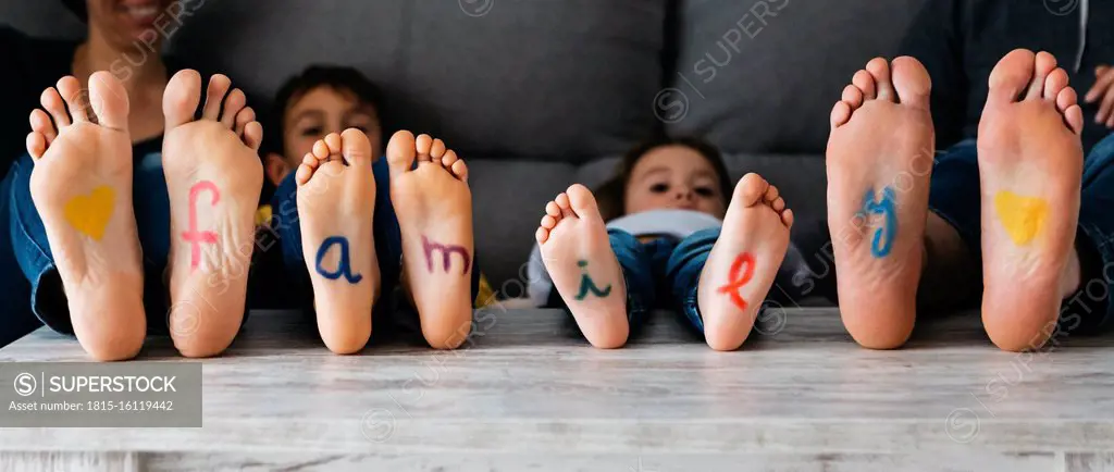 Soles of the feet with the word family