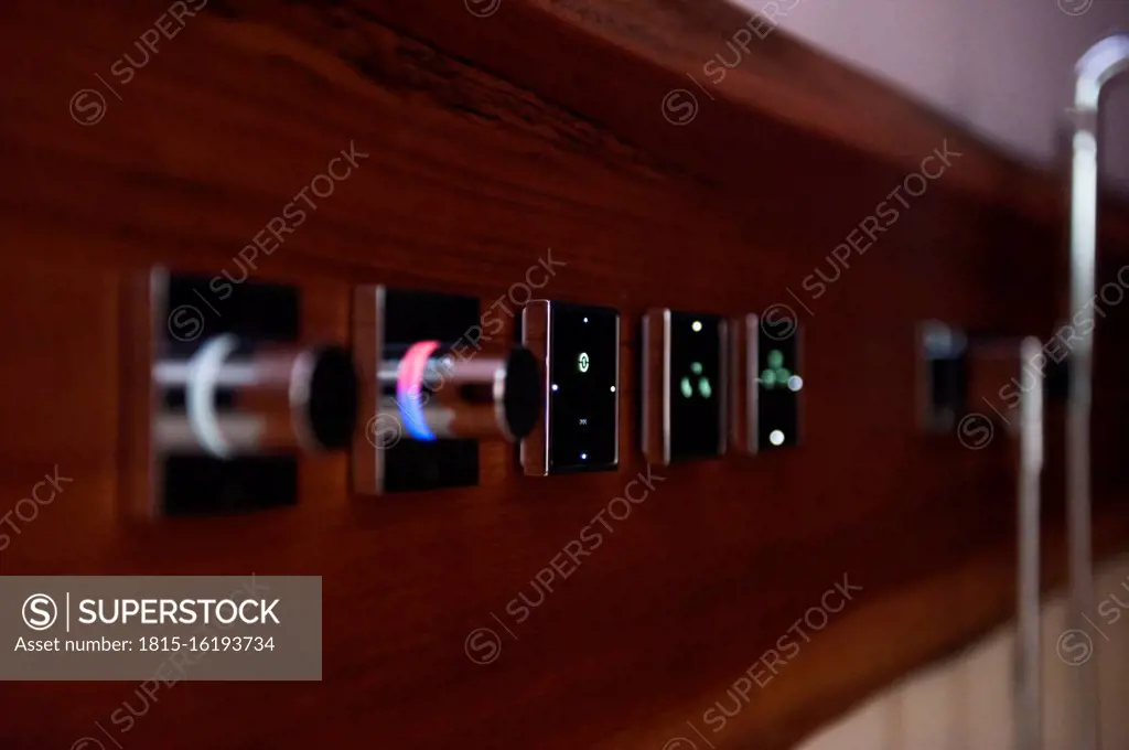 Digital push buttons of kitchen sink on wall