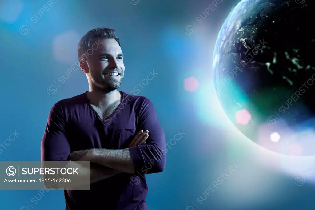 Happy laughing man watching earth