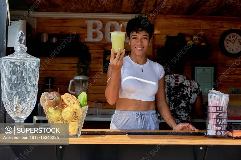 Woman in a food truck offering cup of lemonade