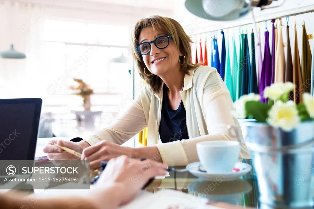 Female fashion designers working in office