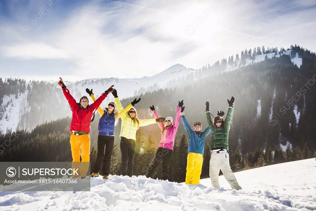 Group of carefree friends having fun in snow, Achenkirch, Austria