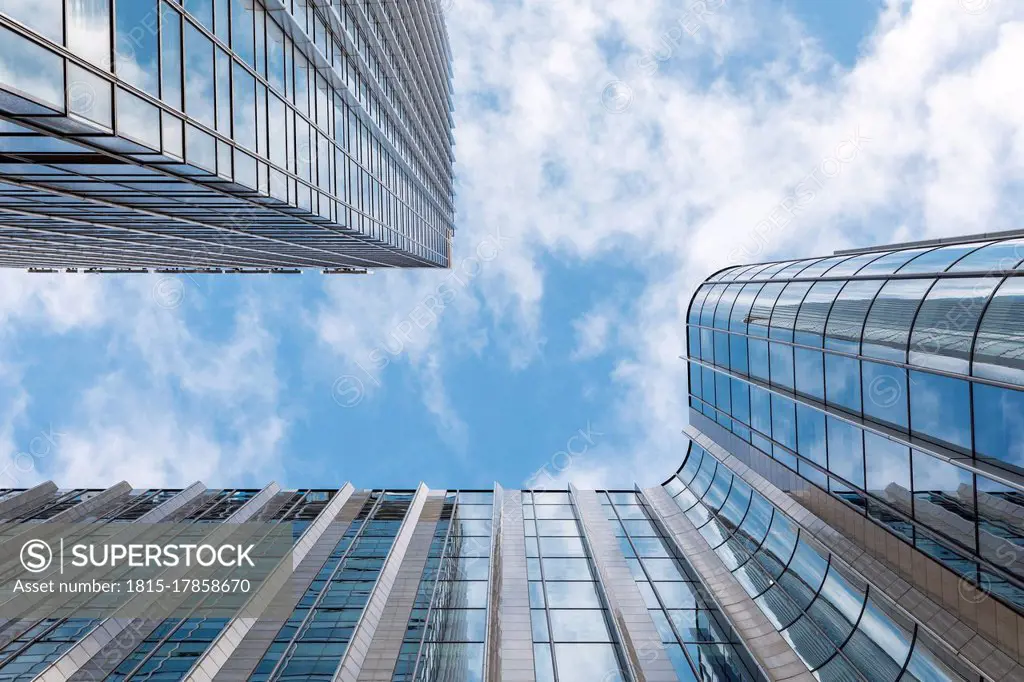 Tall modern office skyscrapers against blue sky, London, UK