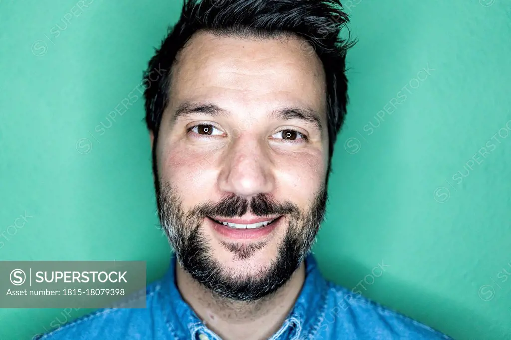 Studio portrait of smiling man