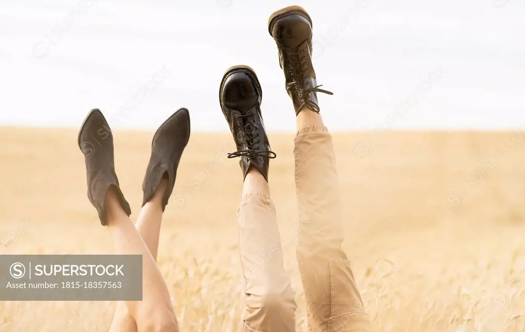 Couple with feet up at agricultural field
