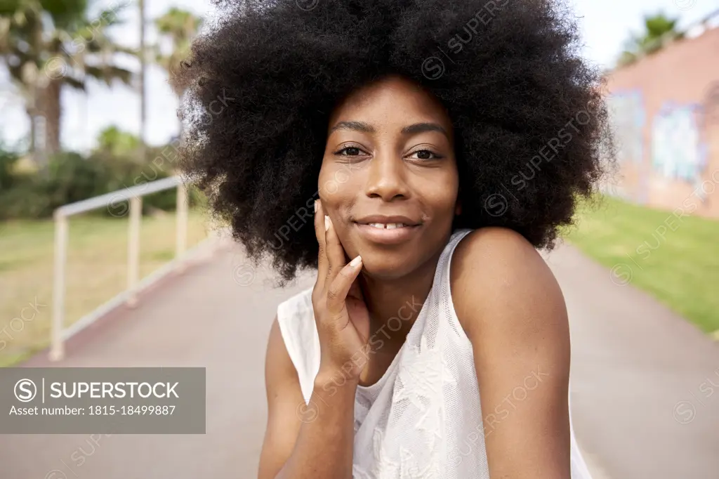 Afro young woman smiling on road