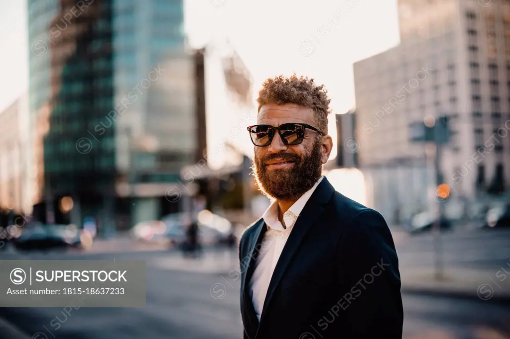 Male professional wearing sunglasses on street