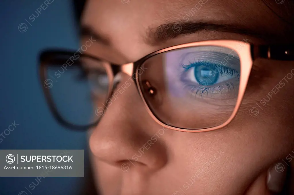 Thoughtful mid adult woman wearing eyeglasses