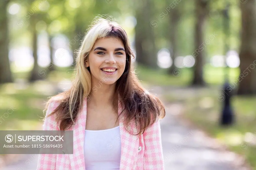 Beautiful woman smiling in public park