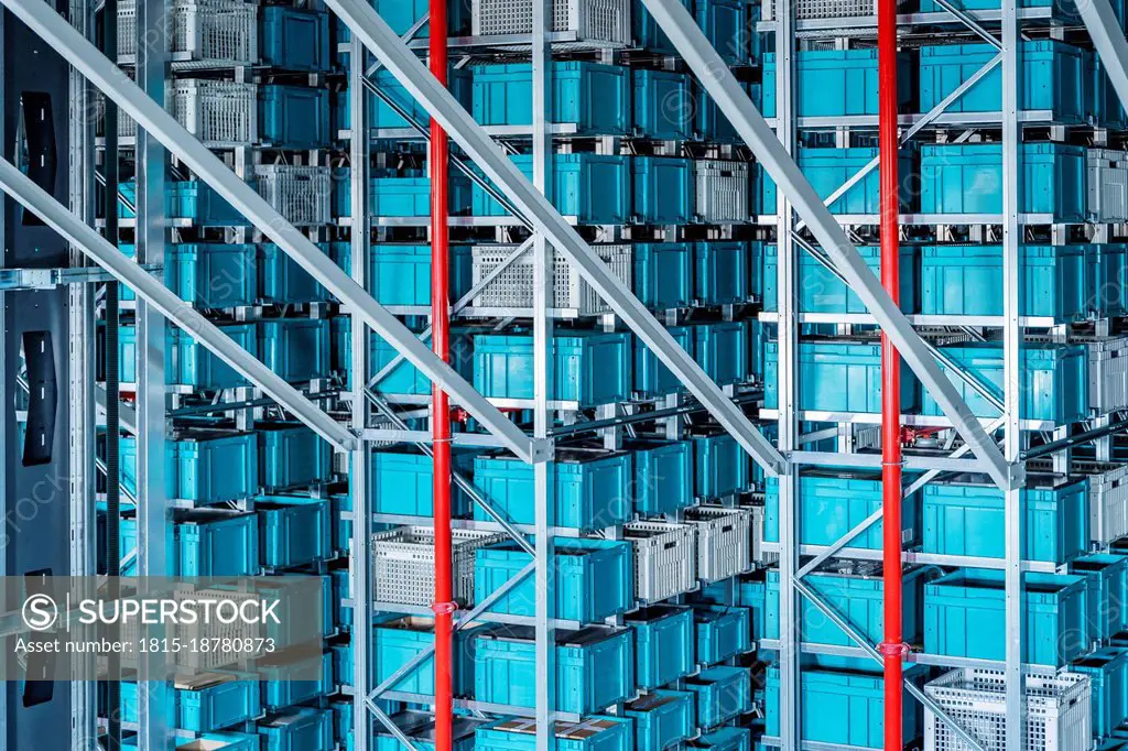 Blue containers in automatized high rack at warehouse