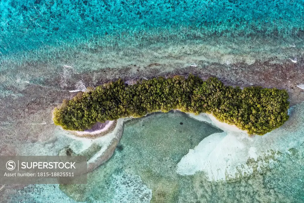 Desert island amidst sea in Lhaviyani Atoll, Maldives
