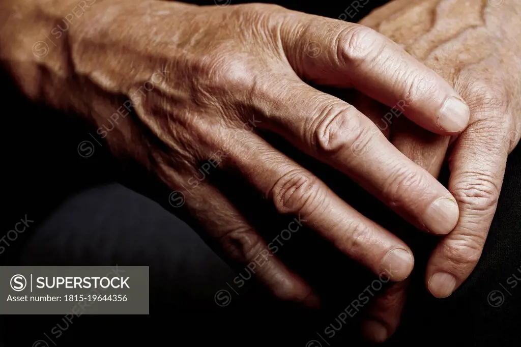 Hands of senior man with wrinkled skin
