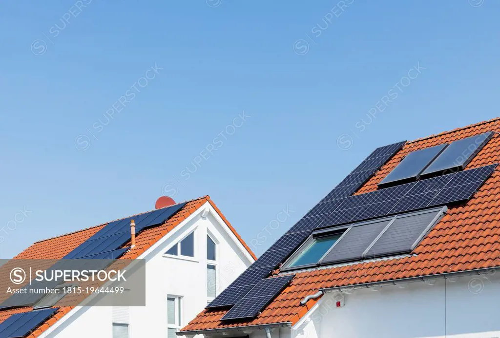 Germany, North Rhine-Westphalia,¶ÿSolar panels on tiled roofs of modern suburban houses