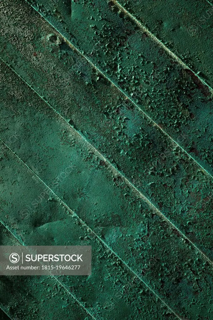 Close-up of old green weathered door