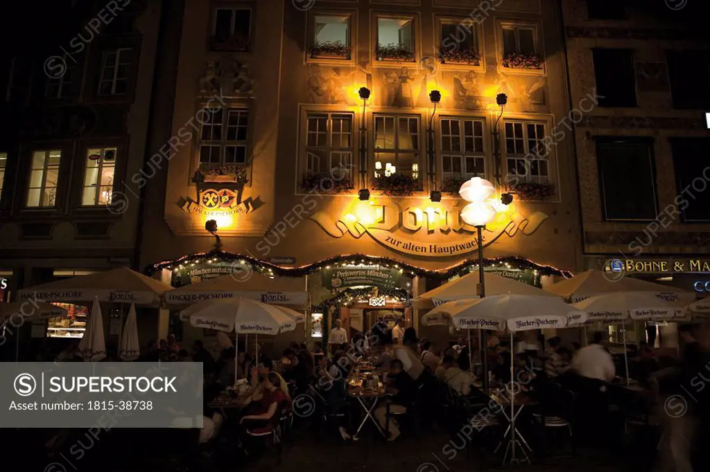 Germany, Bavaria, Munich, Outdoor cafe at night