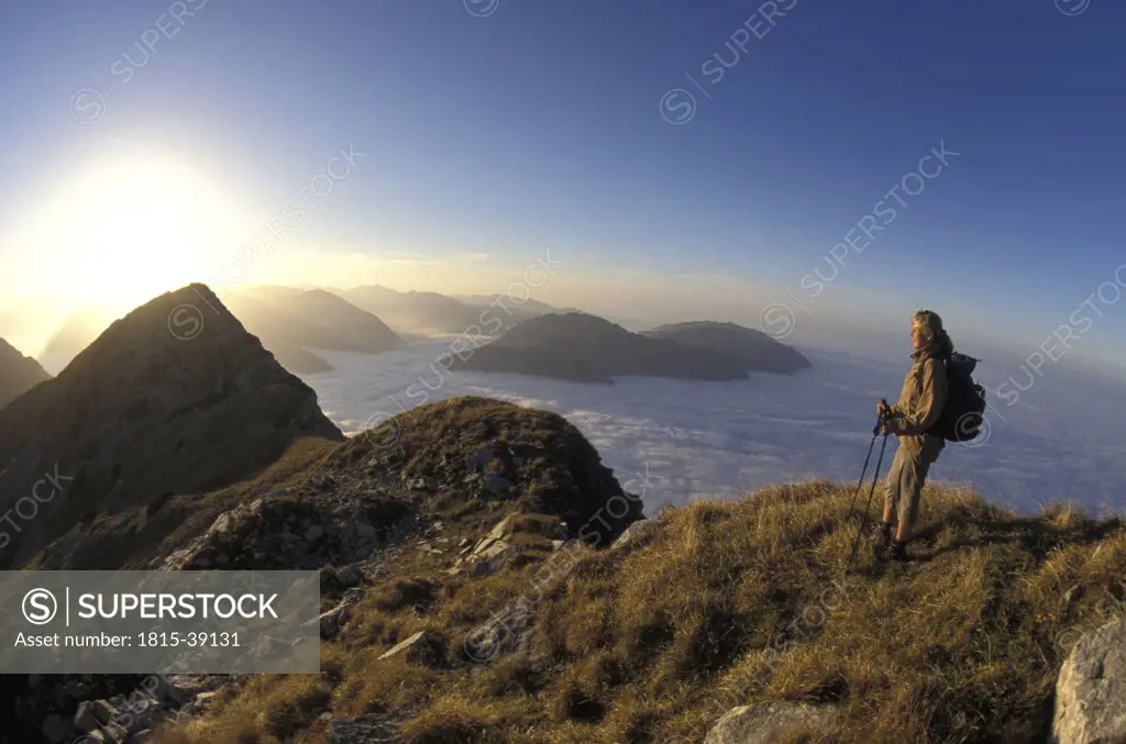 Man standing on mountain ridge