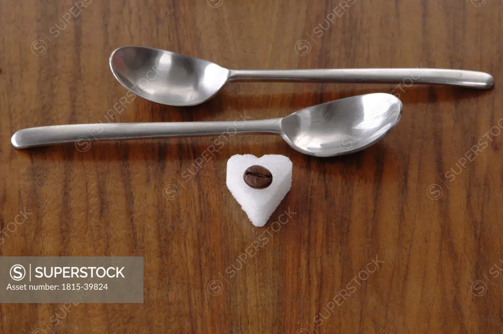 Sugar heart, coffee bean and spoons