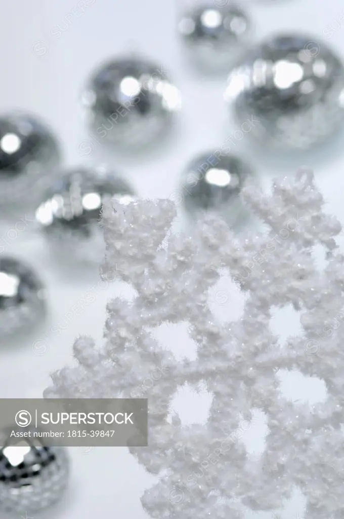 Artificial snowflake and Christms baubles