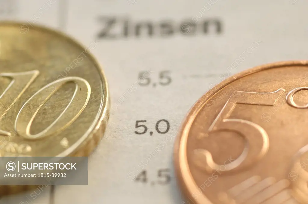 Euro coins on business journal