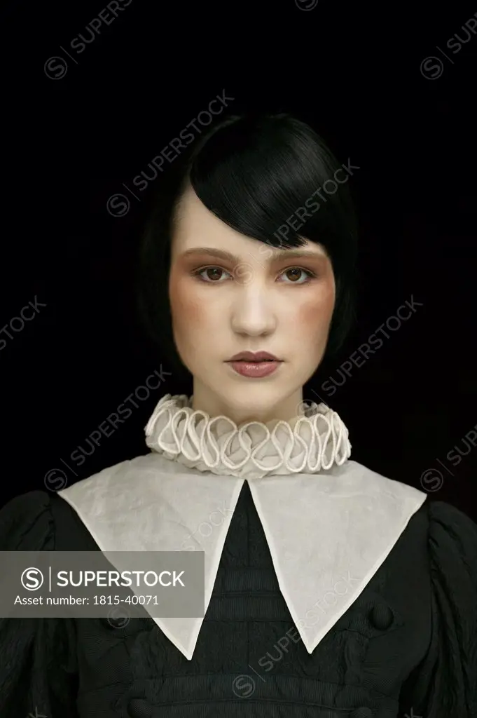 Young woman wearing gown with ruff and collar, portrait
