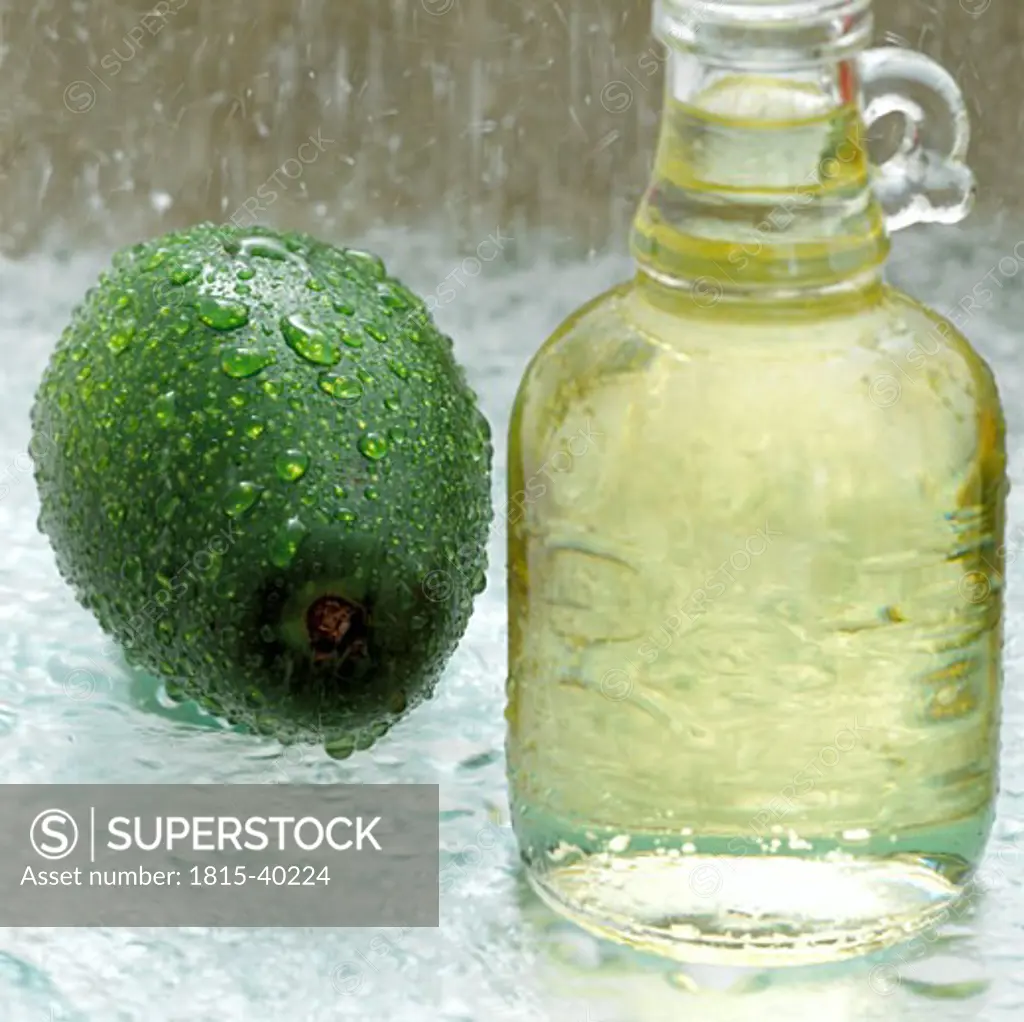 Avocado and soy bean oil in glass bottle, close-up