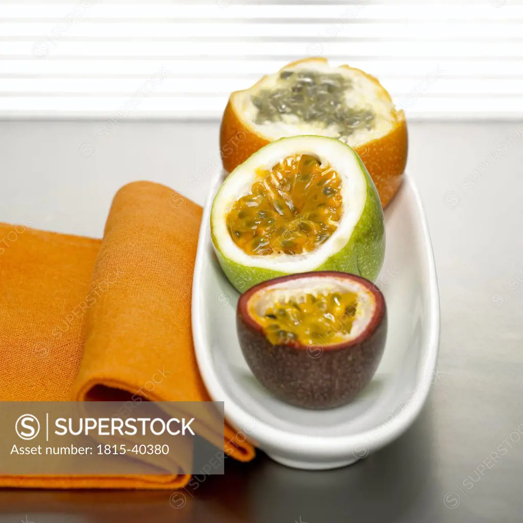 Passion fruits in bowl and cloth napkin