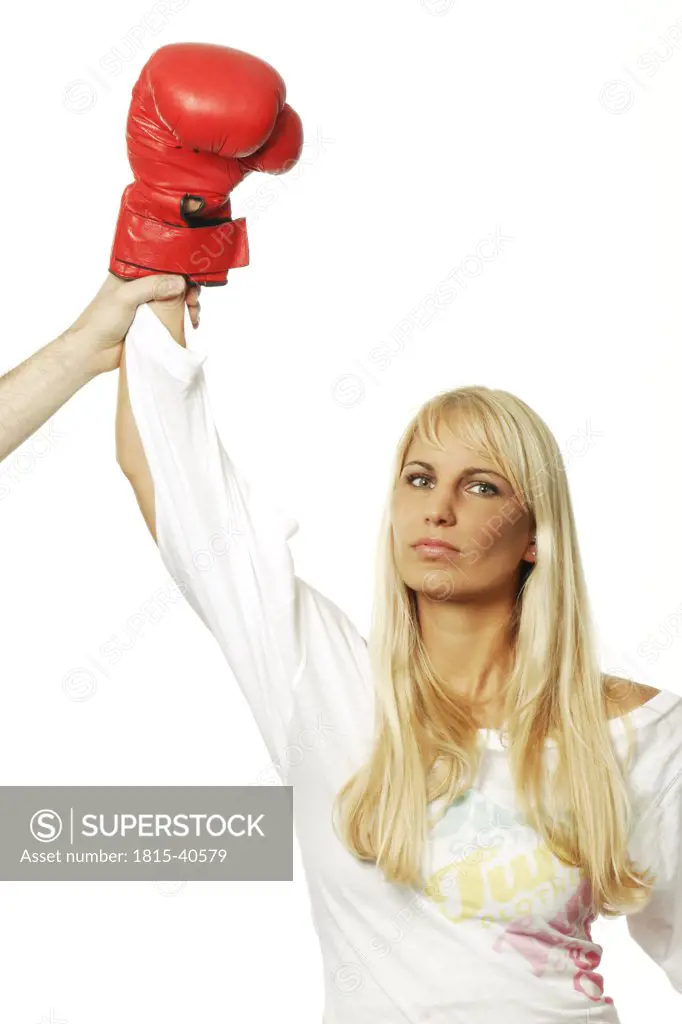 Woman with red boxing glove winning a fight