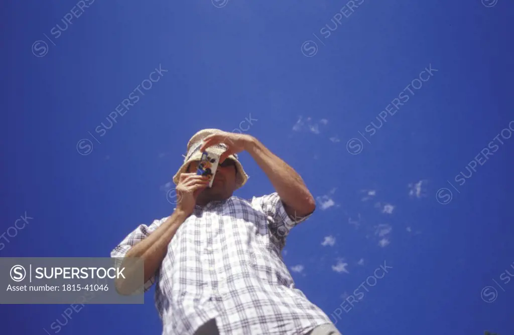 Man taking an foto, low angle view