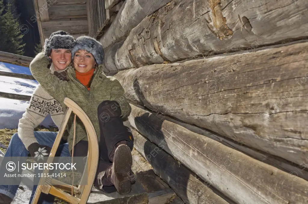 Austria, Salzburger Land, Altenmarkt, Young couple taking a break at cabin