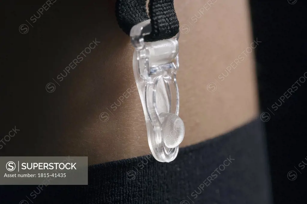 Woman wearing suspender belt, close-up