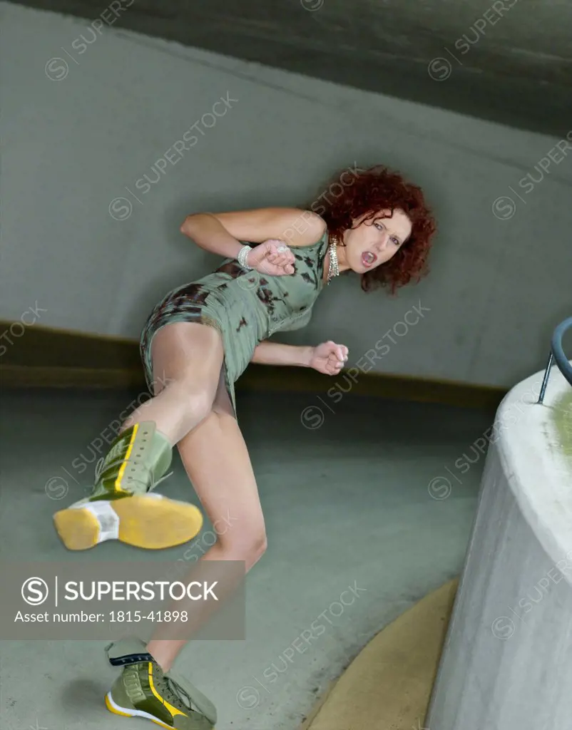 young woman kicking