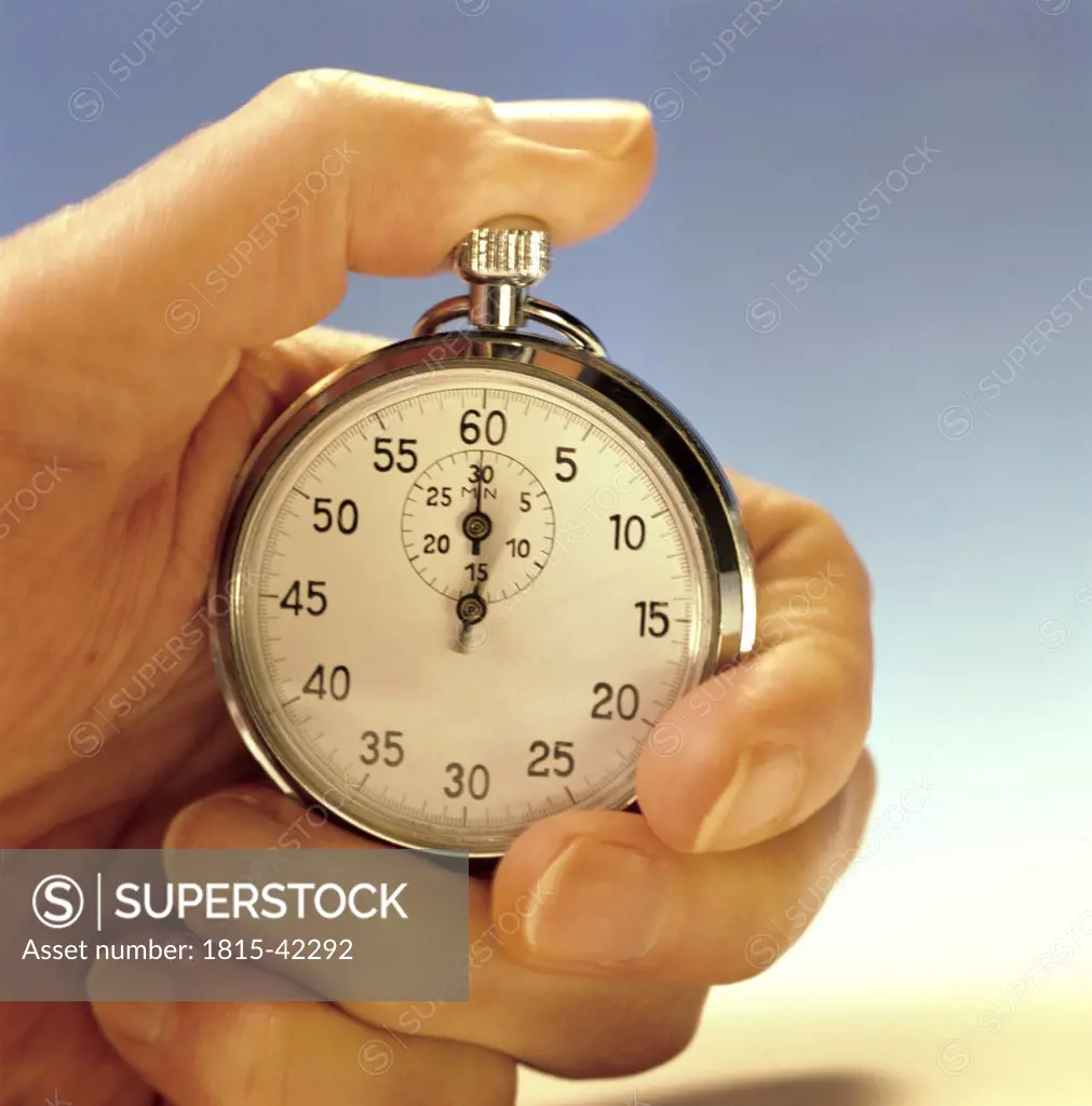 Man holding stop watch