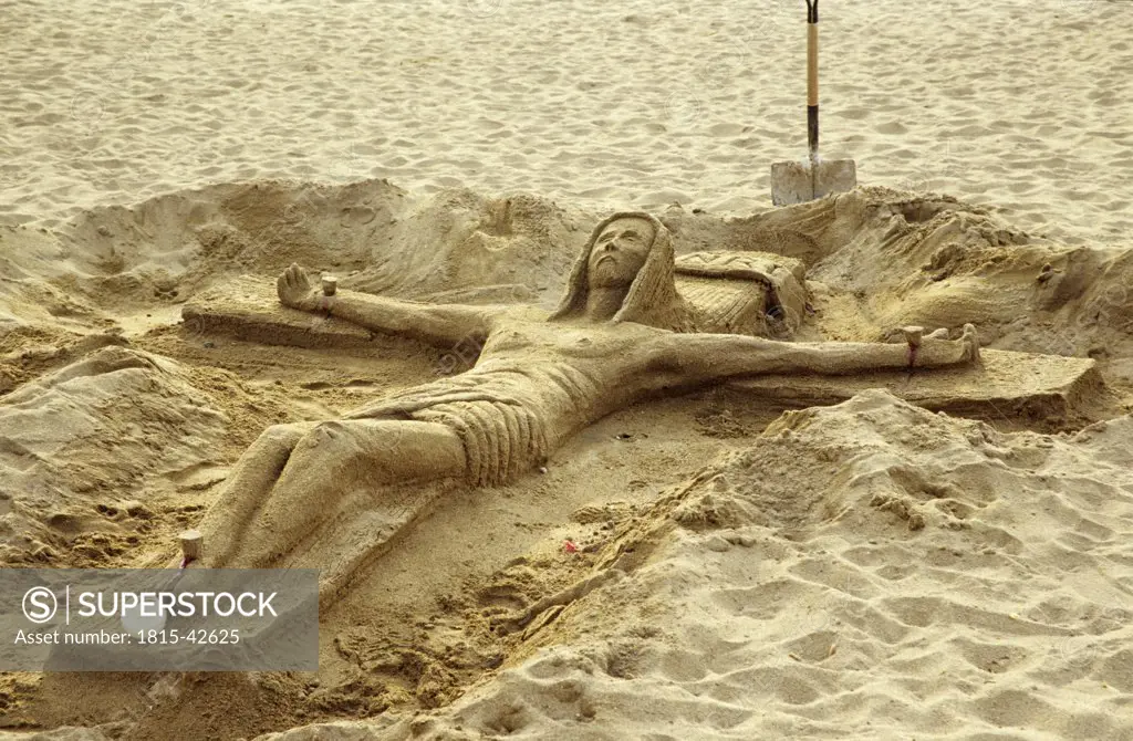Crucifix made of sand, Barcelona, Spain