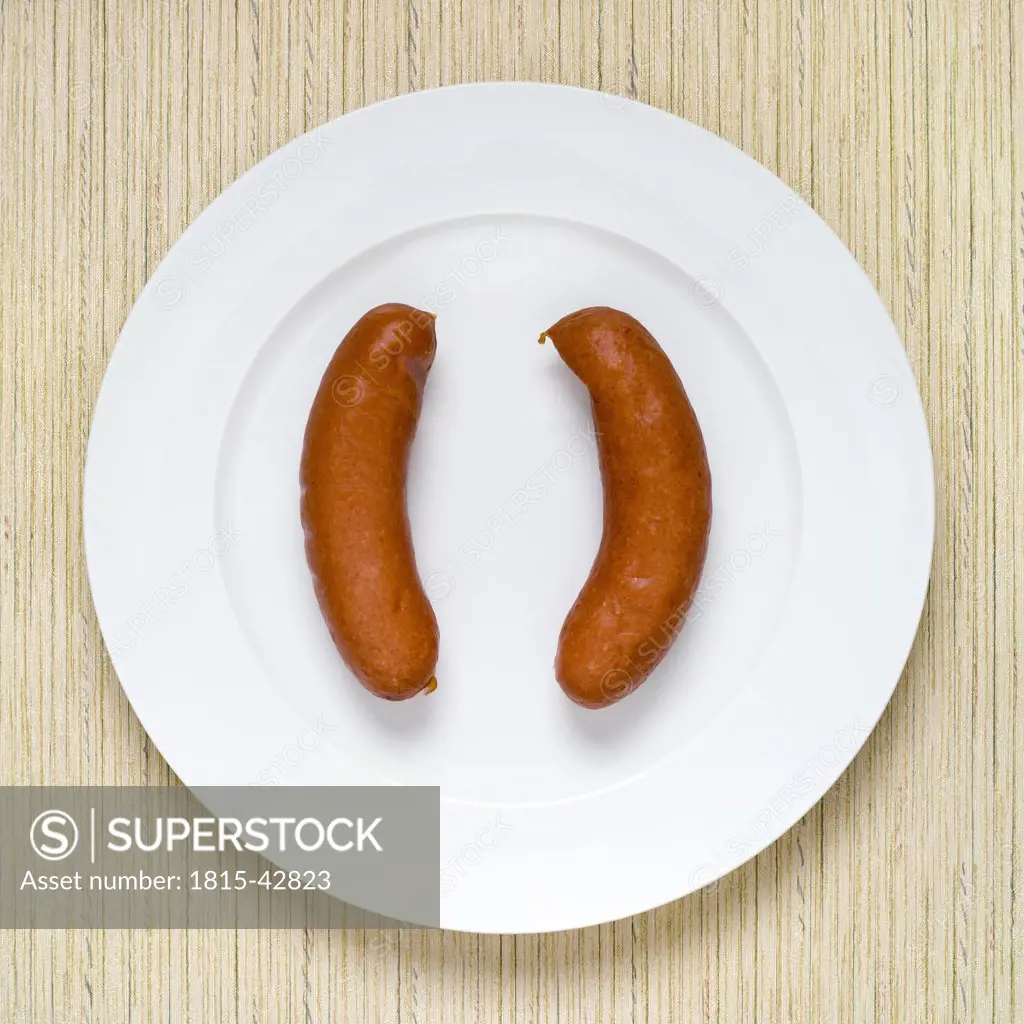 Sausage on plate, elevated view