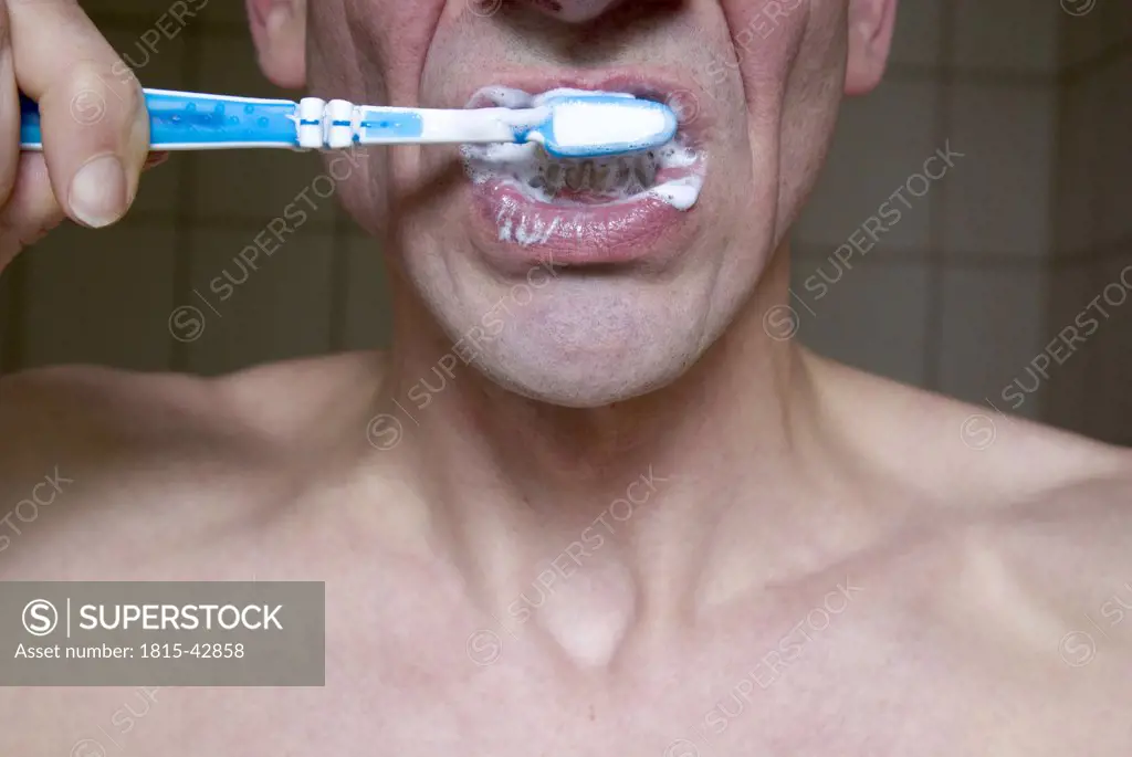 Man brushing his teeth, upper section