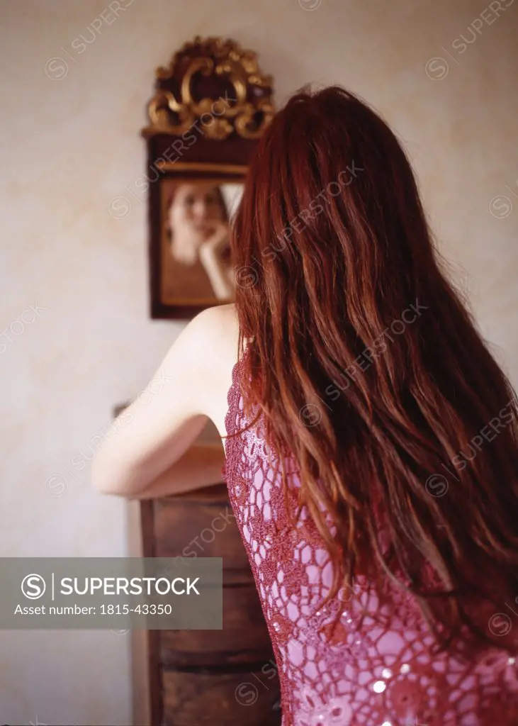 Redhaired woman, rear view