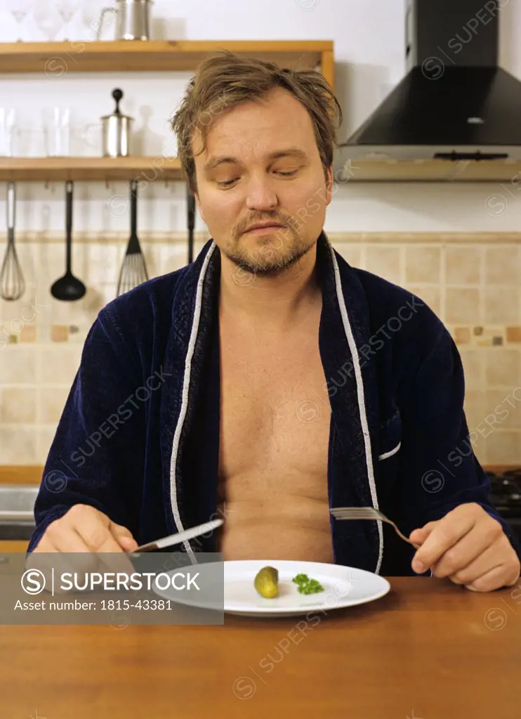 man going to eat a cucumber