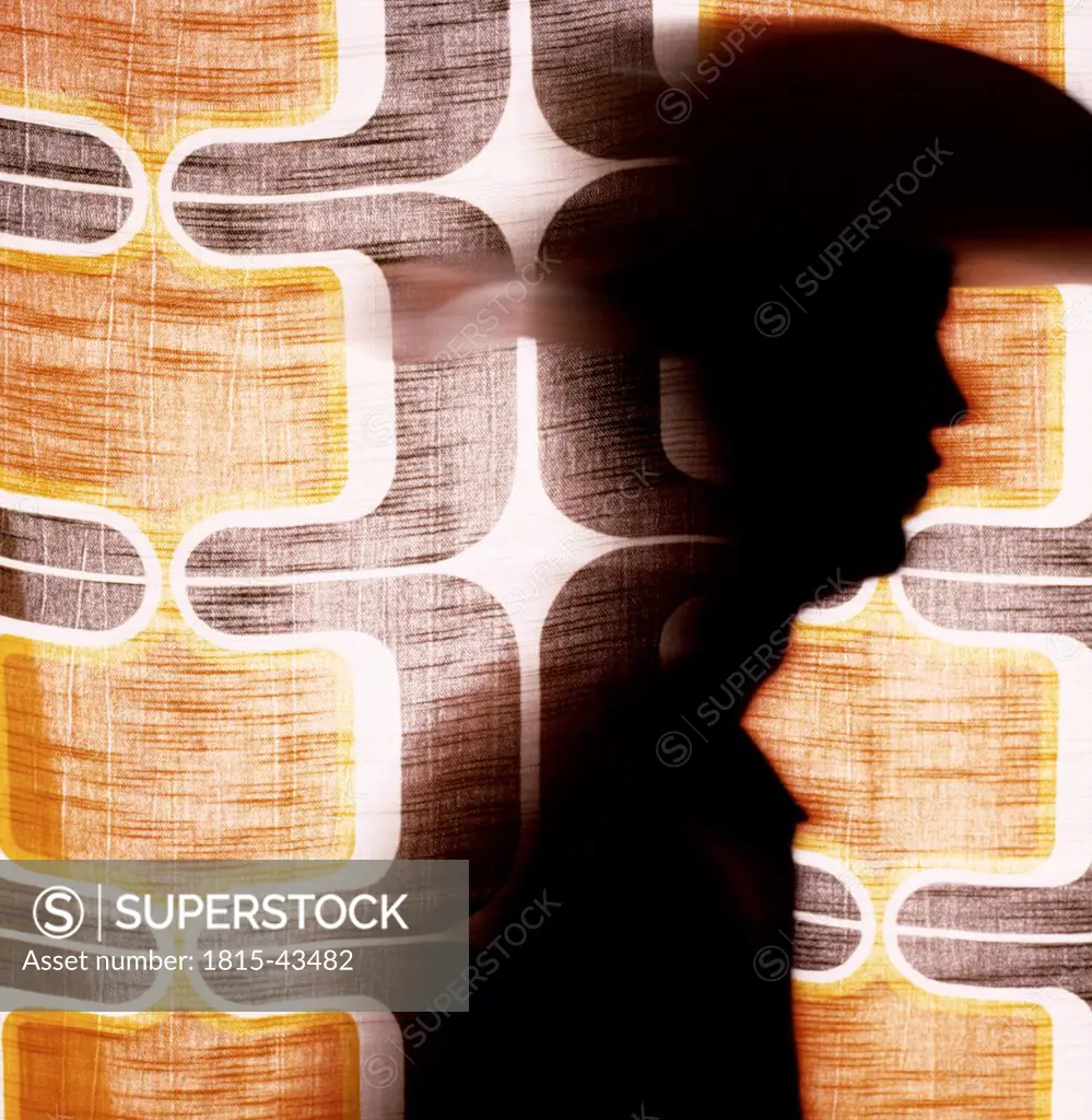 Silhouette behind curtain