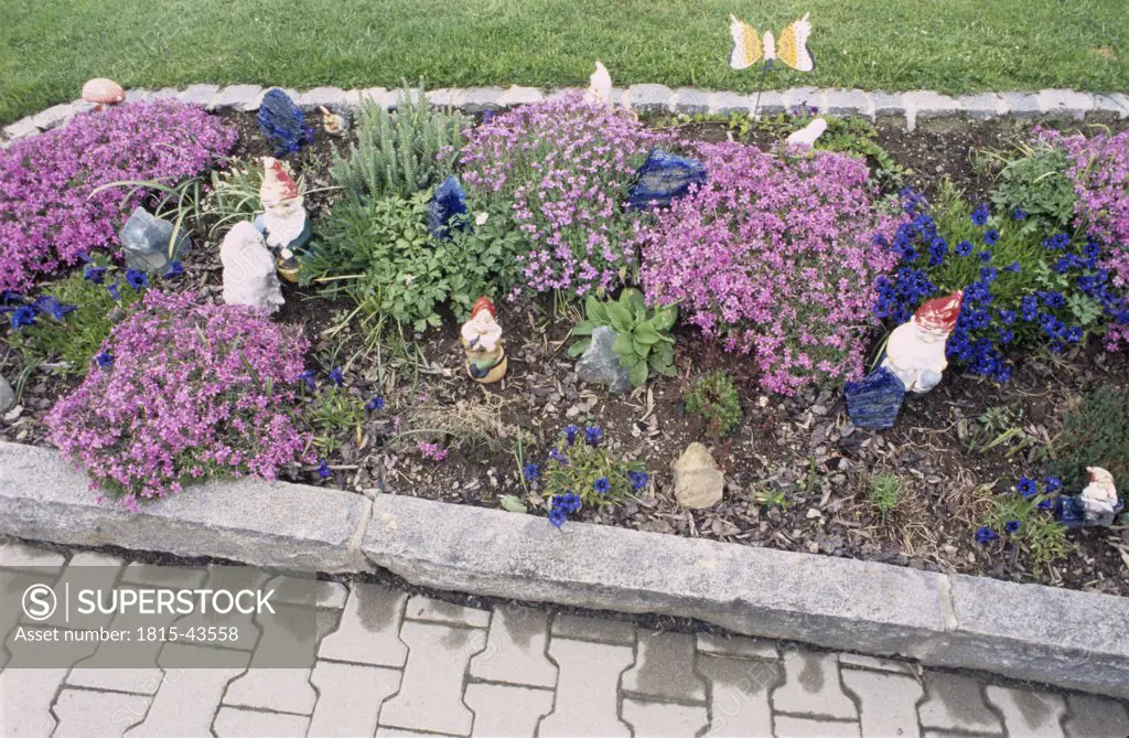 Flowerbed with garden gnomes