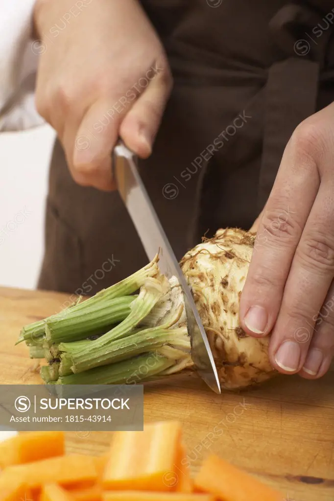 Cutting celeriac, close-up