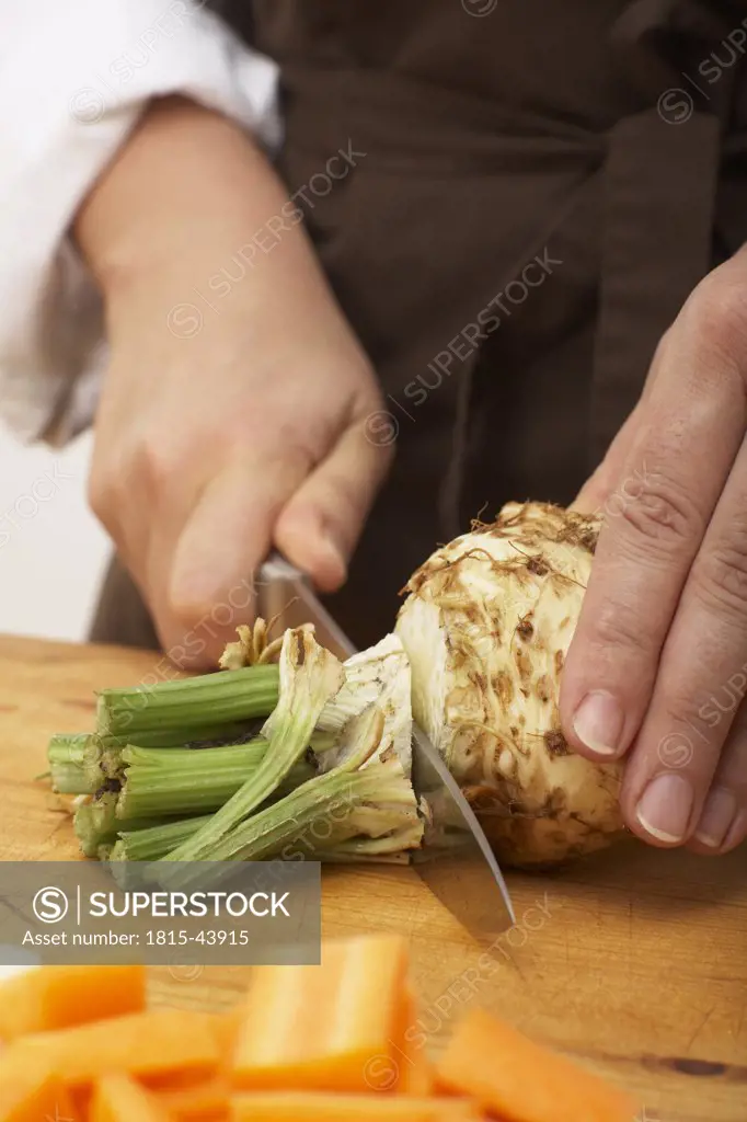 Cutting celeriac, close-up