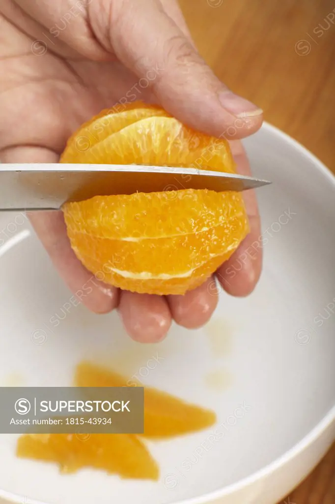 Filleting oranges, close-up